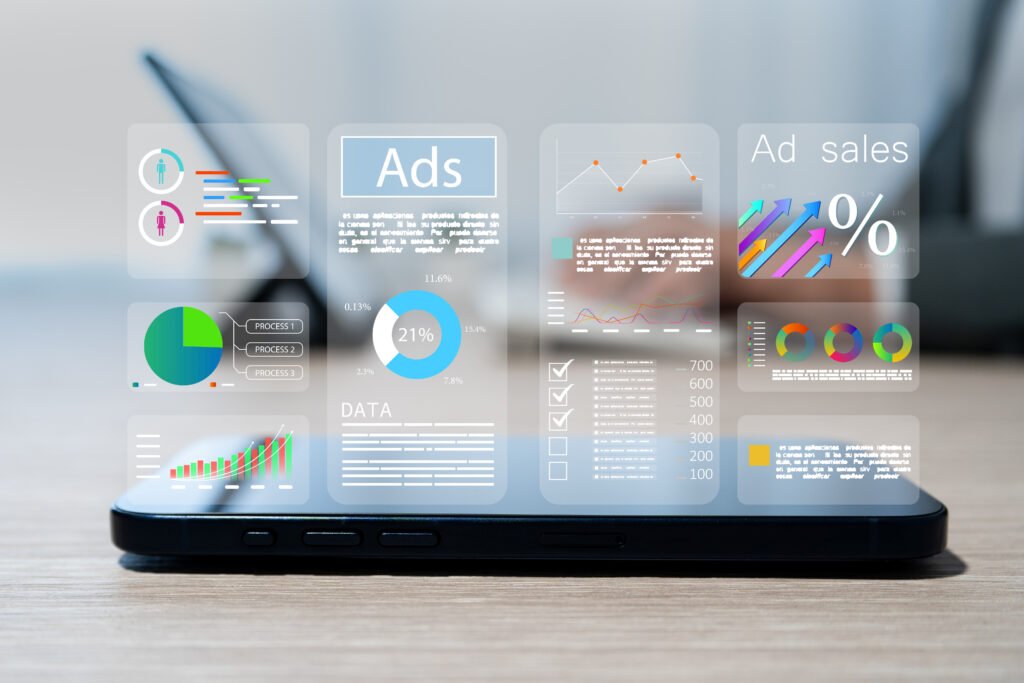 Concepts of digital advertising and marketing analytics insights into customer engagement and social media strategy - Wyfi Marketing - Wyfi Marketing Smartphone on a wooden table with translucent data dashboards and charts hovering above the screen image for analytics.
